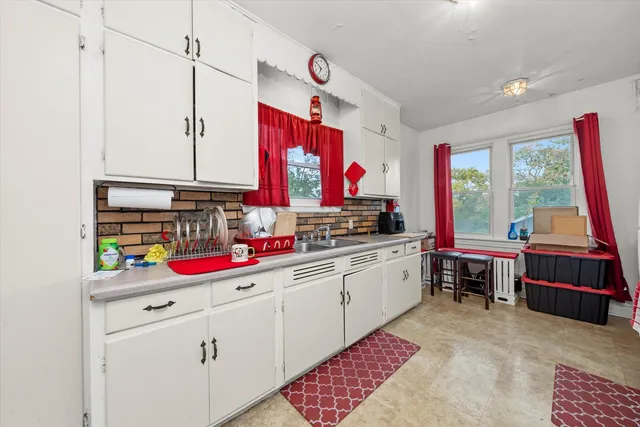 a kitchen with stainless steel appliances granite countertop a sink and dishwasher a cabinets with wooden floor