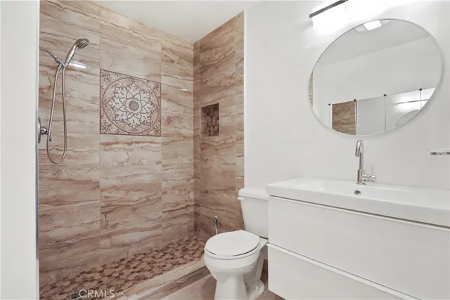 a bathroom with a toilet and a sink