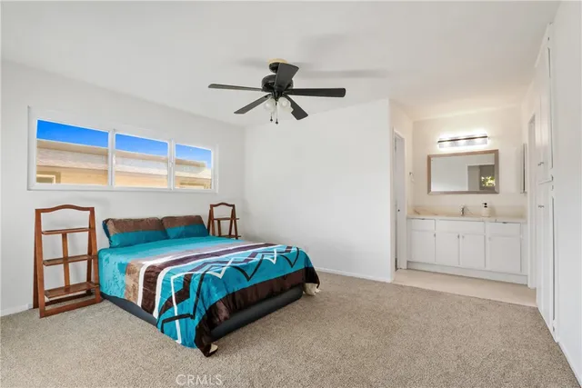 a bedroom with a bed and a cabinets