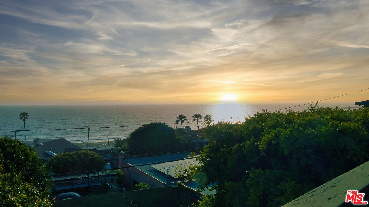 a view of a yard and mountain in the back