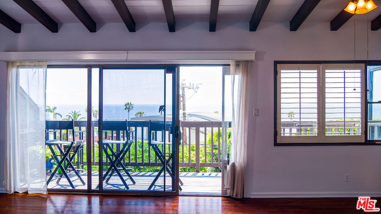 7505 Rindge Avenue Playa del Rey, CA 90293 - Photo 13 of 29 a view of front door and porch with wooden floor