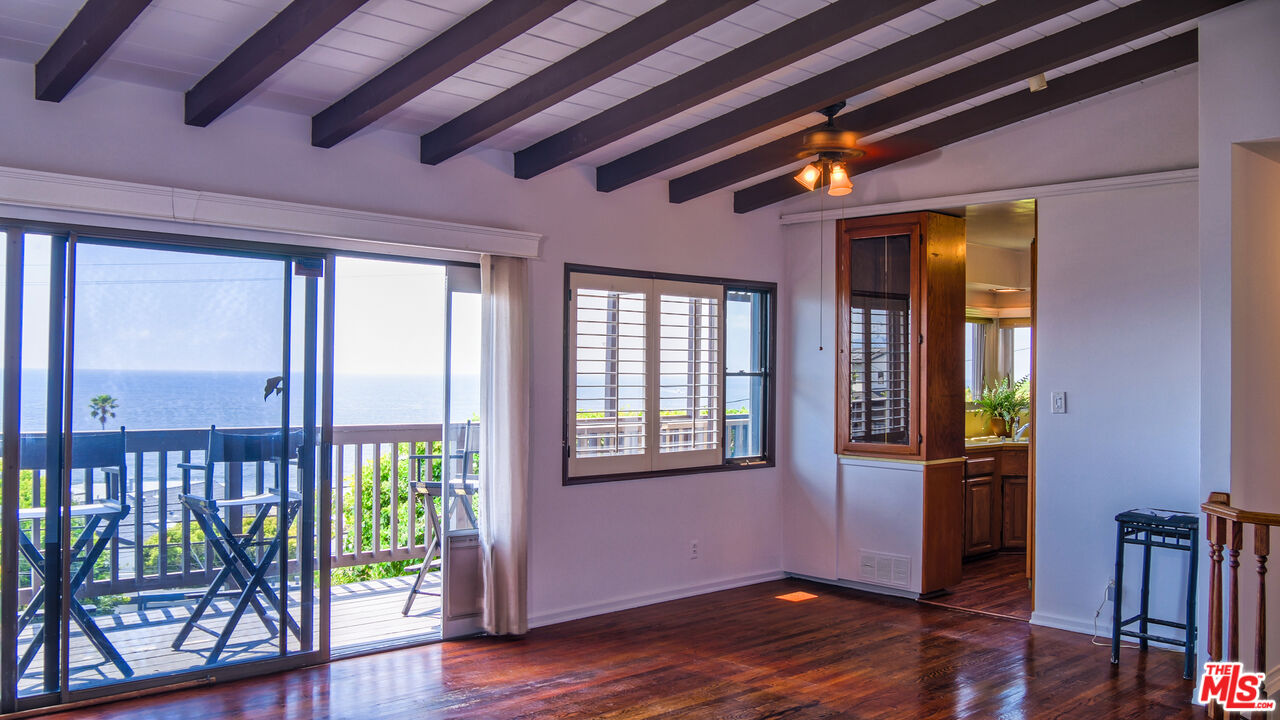 7505 Rindge Avenue Playa del Rey, CA 90293 - Photo 15 of 29 a view of an empty room with wooden floor and a window
