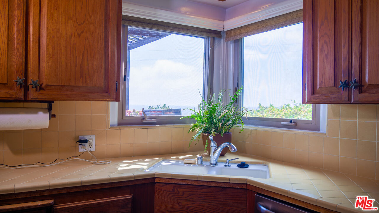 7505 Rindge Avenue Playa del Rey, CA 90293 - Photo 17 of 29 a kitchen with a sink and a window