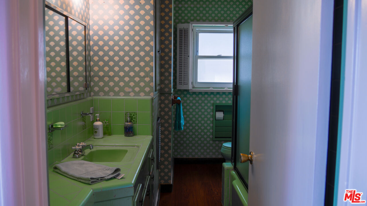7505 Rindge Avenue Playa del Rey, CA 90293 - Photo 19 of 29 a bathroom with a sink toilet and window