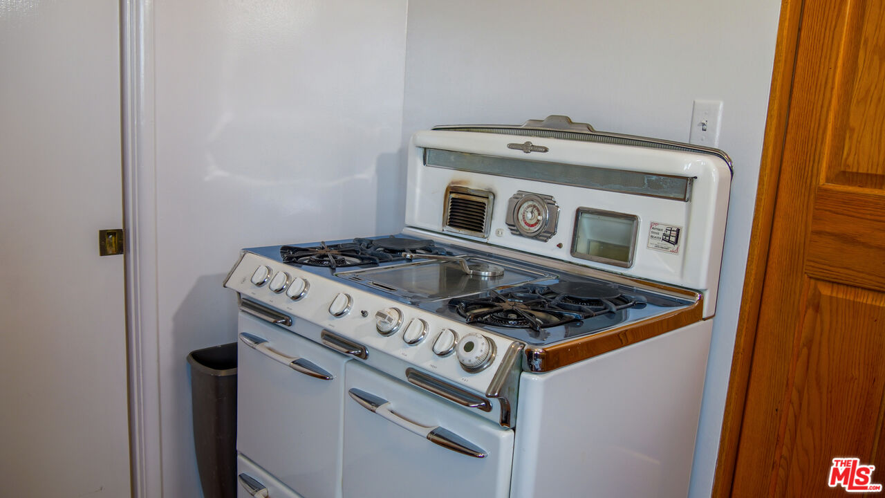 7505 Rindge Avenue Playa del Rey, CA 90293 - Photo 27 of 29 a white stove top oven sitting inside of a kitchen