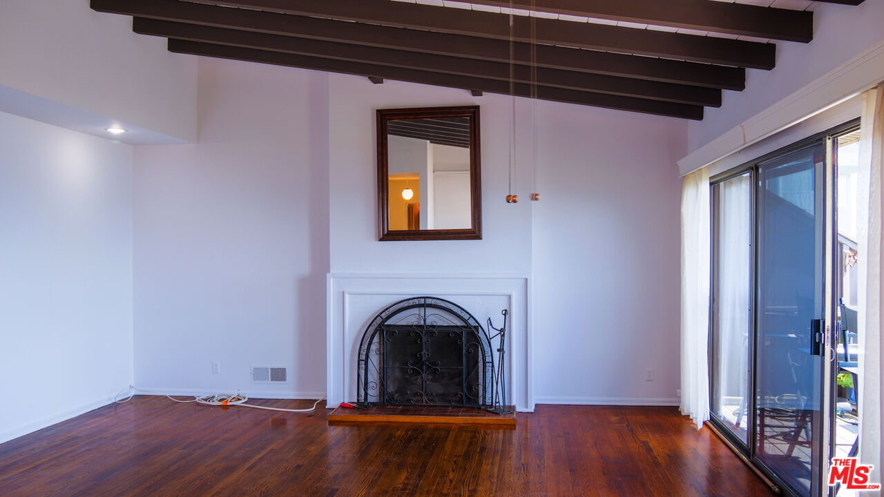 7505 Rindge Avenue Playa del Rey, CA 90293 - Photo 29 of 29 a view of an empty room with wooden floor and a window