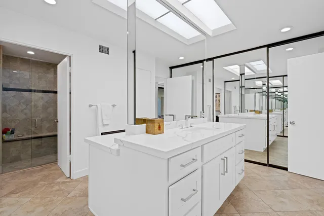 a view of bathroom with dual sinks