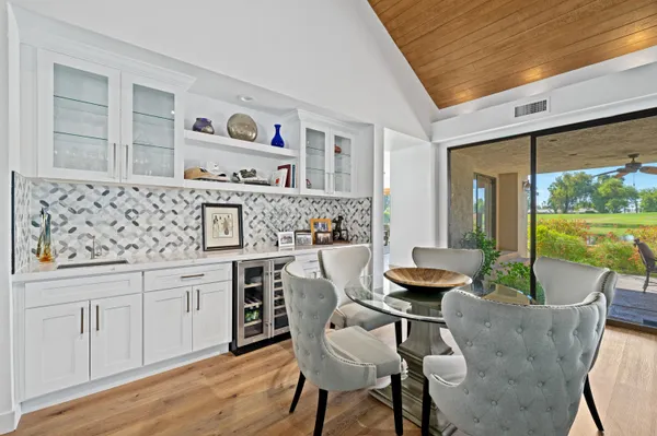 a dining room with furniture and window