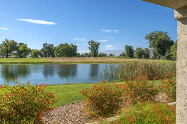 a view of a lake with a yard