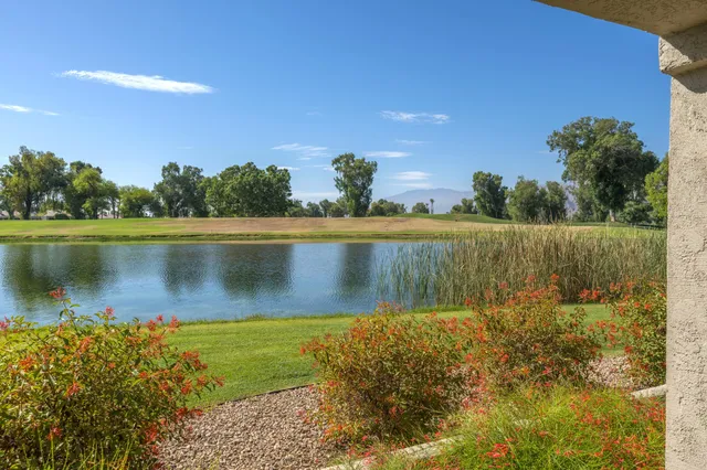 a view of a lake with a yard