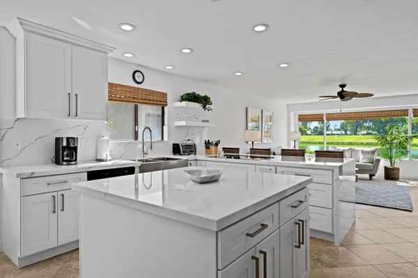 a kitchen with a stove a sink and a refrigerator