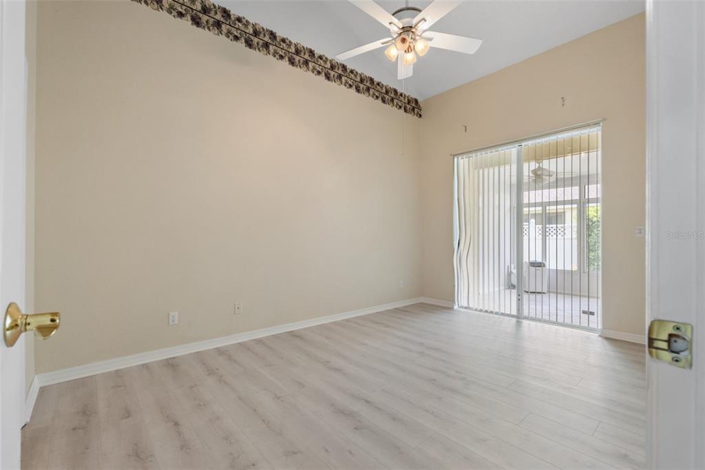 1050 Starkey Road, Unit 704 Largo, FL 33771 - Photo 15 of 27 wooden floor in an empty room with a window