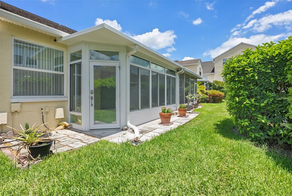 1050 Starkey Road, Unit 704 Largo, FL 33771 - Photo 19 of 27 a view of a house with backyard sitting area and garden