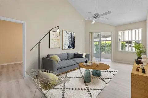 an empty room with wooden floor and mirror