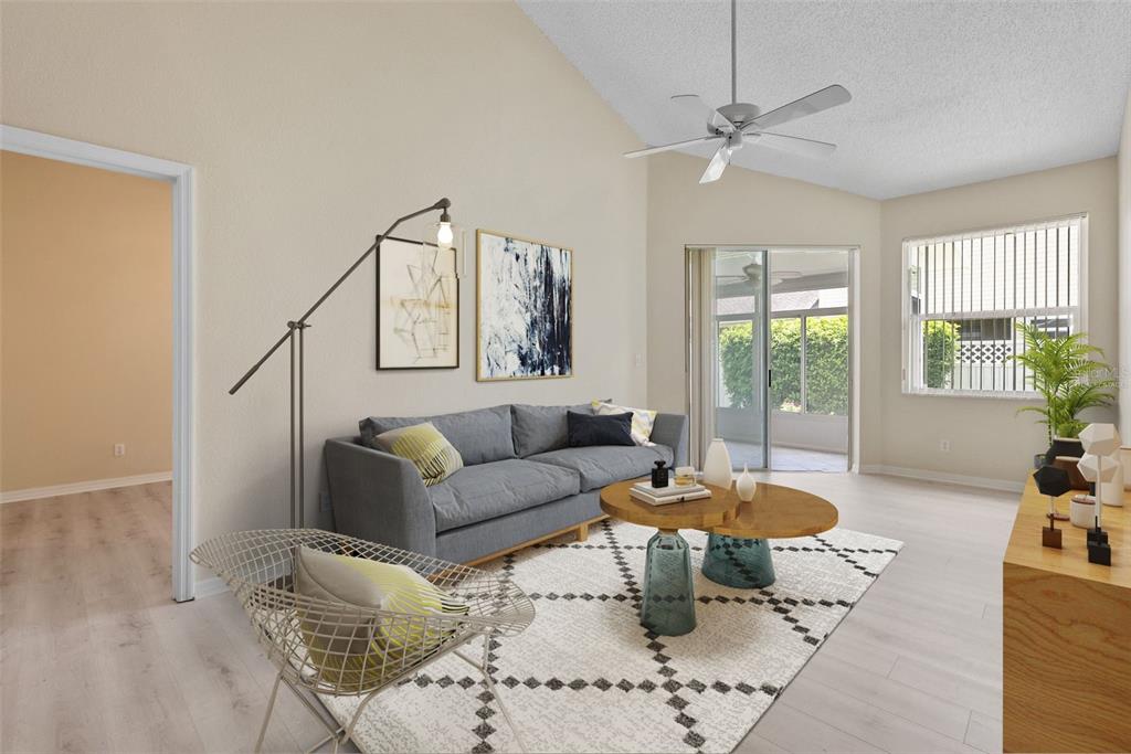 1050 Starkey Road, Unit 704 Largo, FL 33771 - Photo 5 of 27 a living room with furniture and a large window