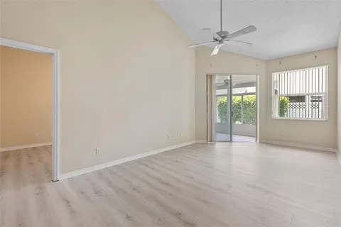 a kitchen with stainless steel appliances granite countertop a refrigerator a stove a sink and a microwave