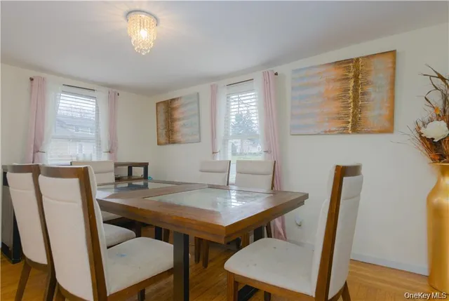 a view of a dining room with furniture and window