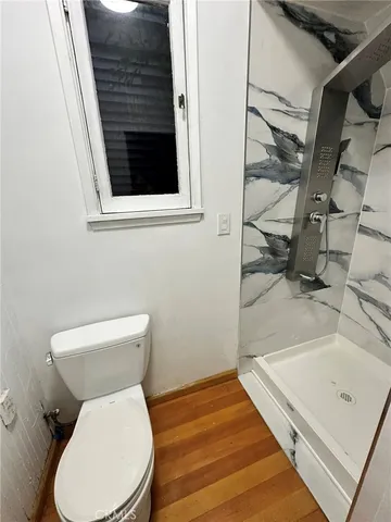 a bathroom with a toilet and a sink