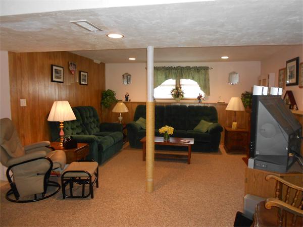 12 Kalmia Road Holbrook, MA 02343 - Photo 14 of 17 a living room with furniture and a flat screen tv