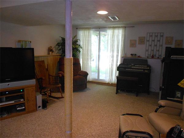 12 Kalmia Road Holbrook, MA 02343 - Photo 16 of 17 a view of a livingroom with furniture and a flat screen tv