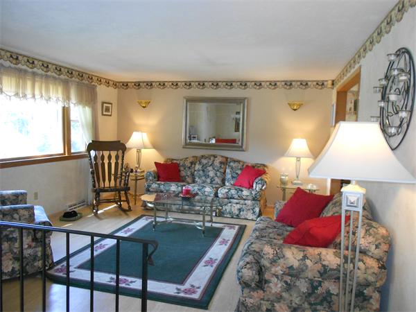 12 Kalmia Road Holbrook, MA 02343 - Photo 7 of 17 a living room with furniture and a large window
