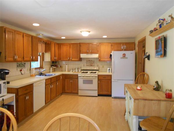 12 Kalmia Road Holbrook, MA 02343 - Photo 8 of 17 a kitchen with a cabinets a sink and appliances