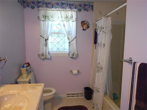 12 Kalmia Road Holbrook, MA 02343 - Photo 10 of 17 a bathroom with a sink and toilet