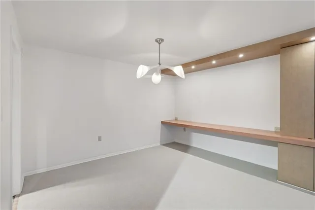 a view of empty room with sliding door