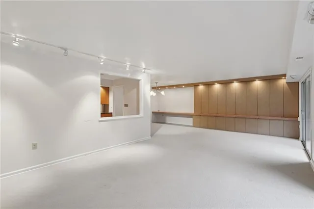 a view of an empty room with a sliding door