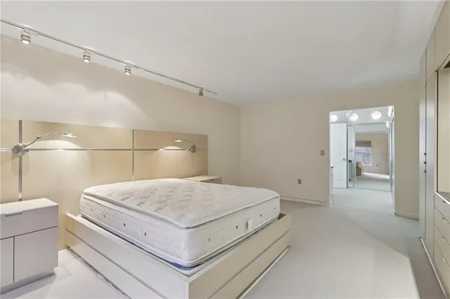 a spacious bathroom with a shower and a sink