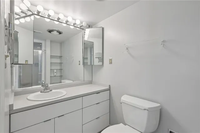 a bathroom with a glass shower door