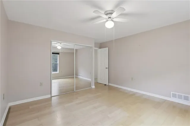 a kitchen with a refrigerator and a stove top oven