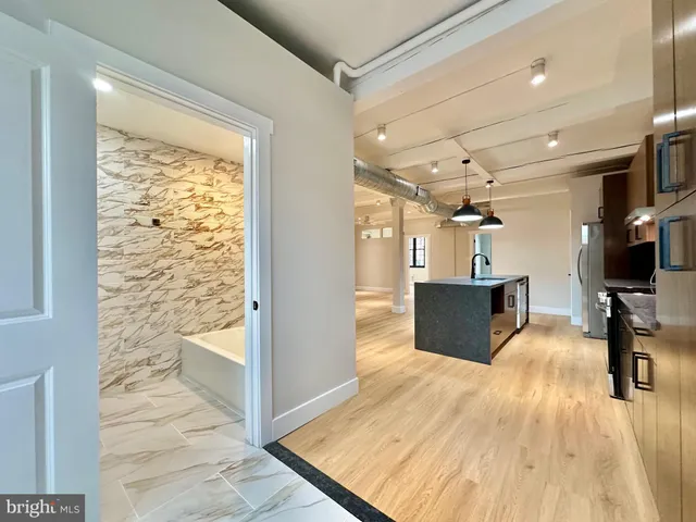 a view of a living room with a wooden floor