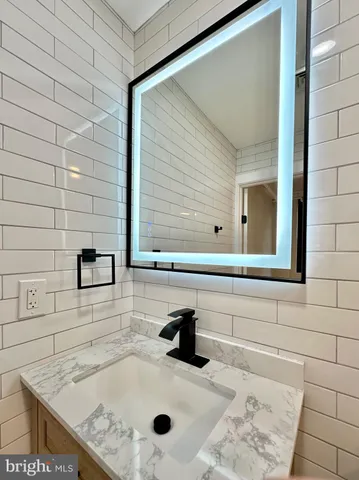 a bathroom with a sink and a shower