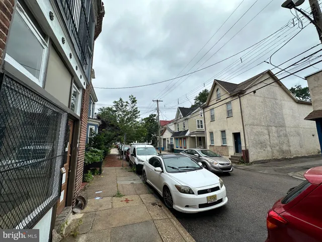 a view of a street with cars
