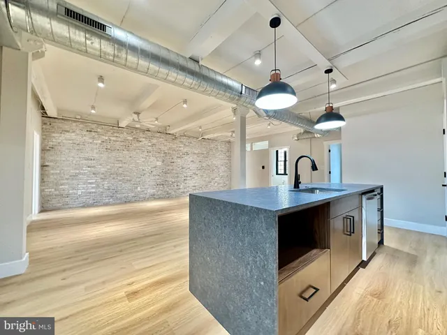 a view of living room with granite countertop furniture and fireplace