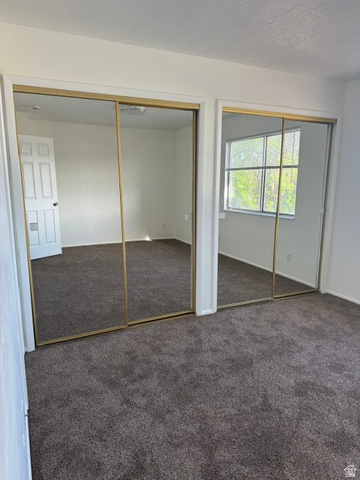 1797 West 950 North, Unit 2 St. George, UT 84770 - Photo 6 of 11 Wall-to-wall carpeting in a neutral tone complements the white walls