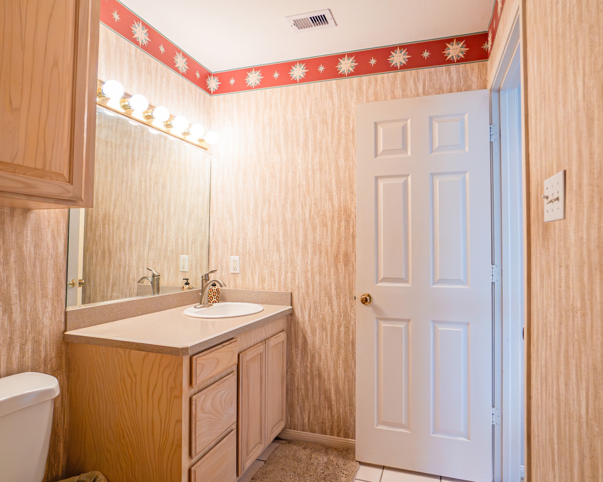 214 Williams Road Bay City, TX 77414 - Photo 46 of 48 a bathroom with a sink a toilet and a shower curtain