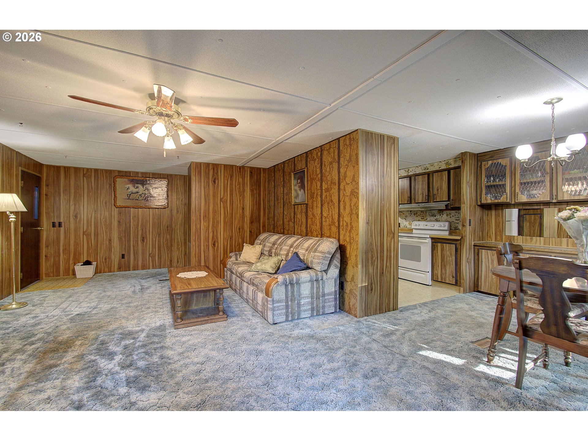 41615 Northeast Cedar Ridge Road Amboy, WA 98601 - Photo 11 of 44 a living room with a couch and a chandelier
