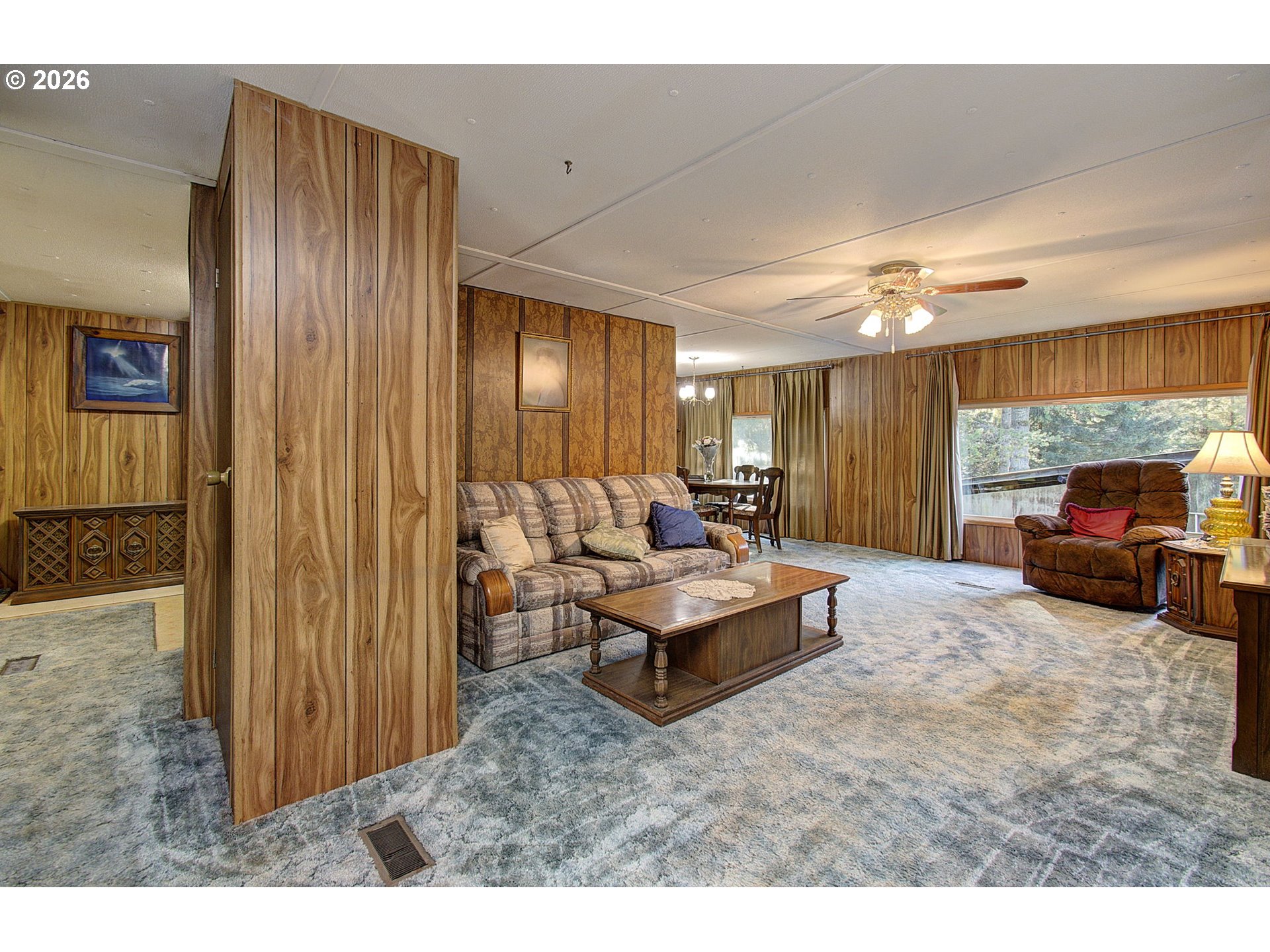 41615 Northeast Cedar Ridge Road Amboy, WA 98601 - Photo 12 of 44 a living room with furniture and a large window