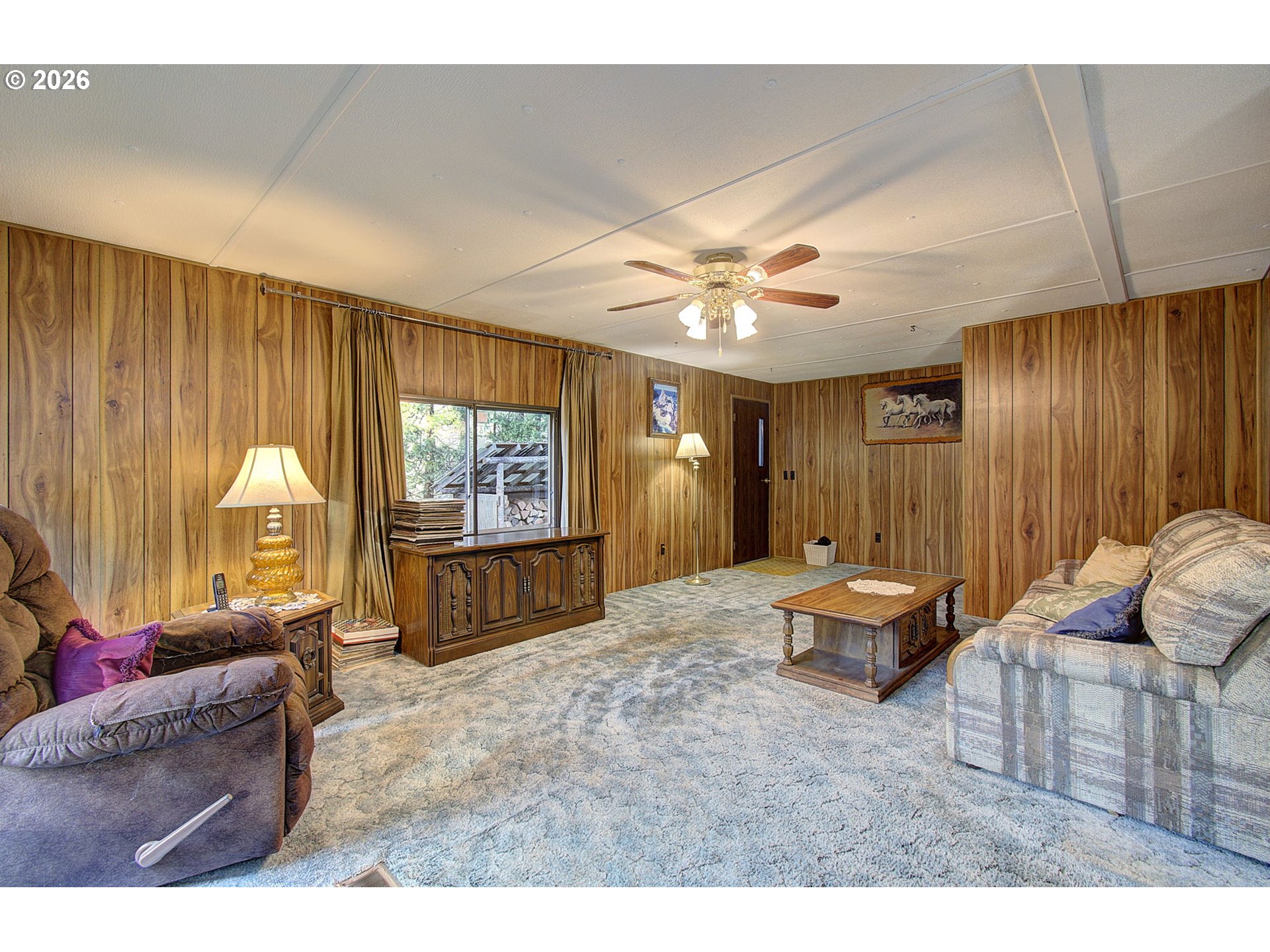 41615 Northeast Cedar Ridge Road Amboy, WA 98601 - Photo 13 of 44 a living room with furniture and a large window