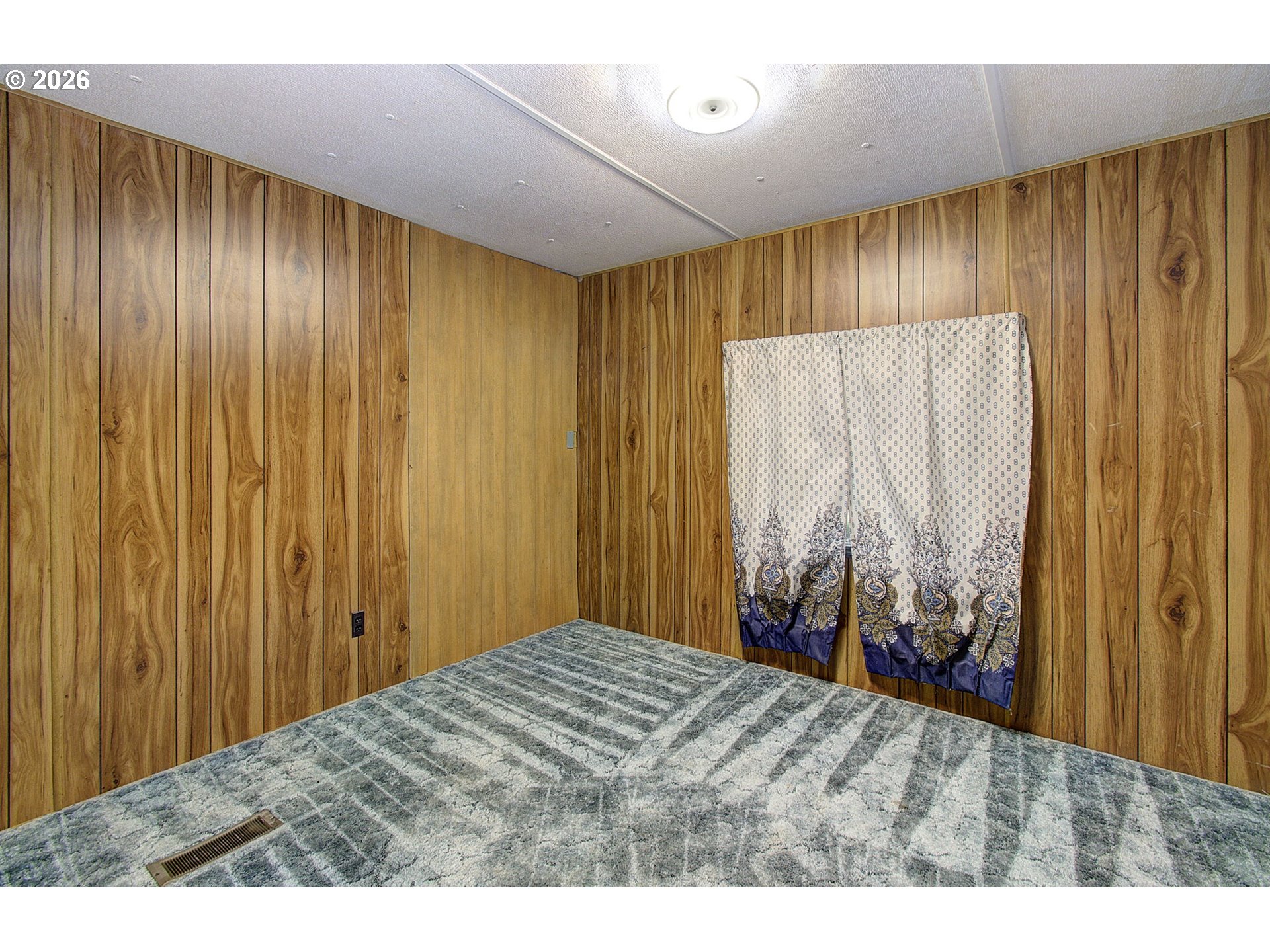 41615 Northeast Cedar Ridge Road Amboy, WA 98601 - Photo 16 of 44 a bedroom with a bed and a chair