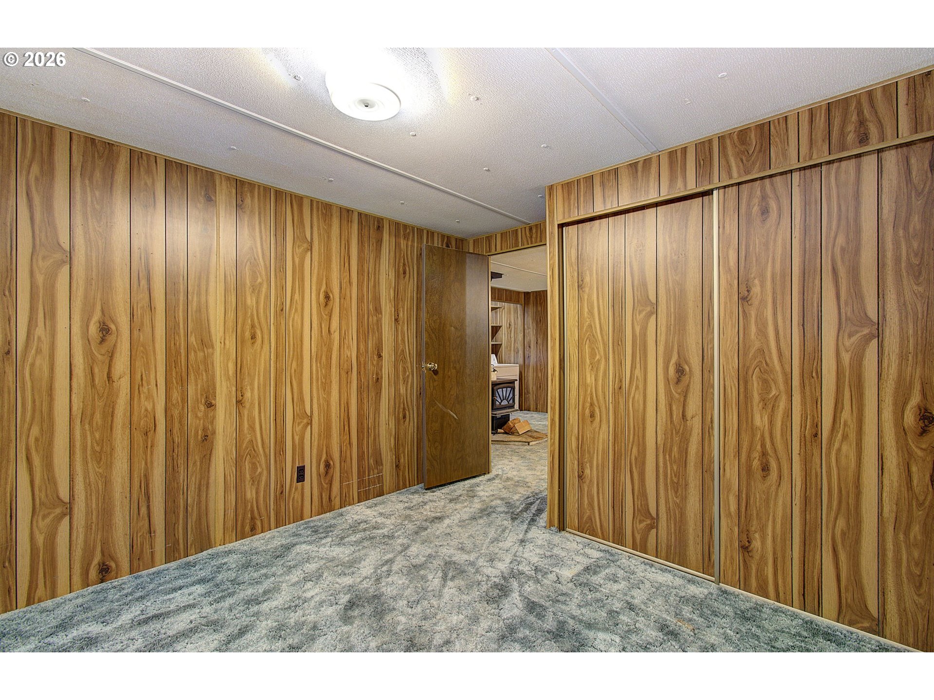 41615 Northeast Cedar Ridge Road Amboy, WA 98601 - Photo 17 of 44 a view of a room with a wooden wall