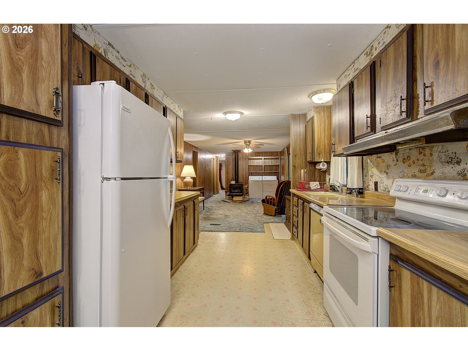 41615 Northeast Cedar Ridge Road Amboy, WA 98601 - Photo 7 of 44 a kitchen with stainless steel appliances a refrigerator sink and cabinets