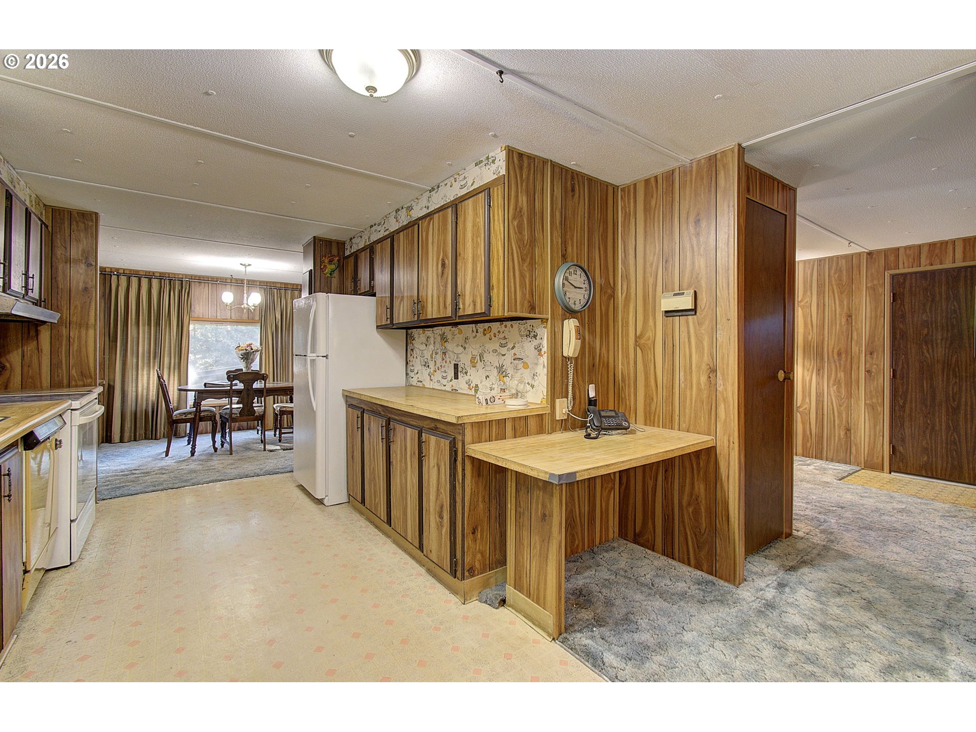 41615 Northeast Cedar Ridge Road Amboy, WA 98601 - Photo 9 of 44 a kitchen with stainless steel appliances kitchen island granite countertop a refrigerator and a sink