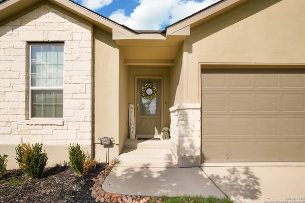 a view of a door and a window
