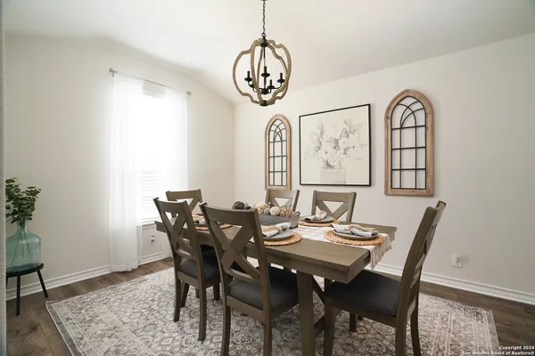 a view of a dining room with furniture window and wooden floor