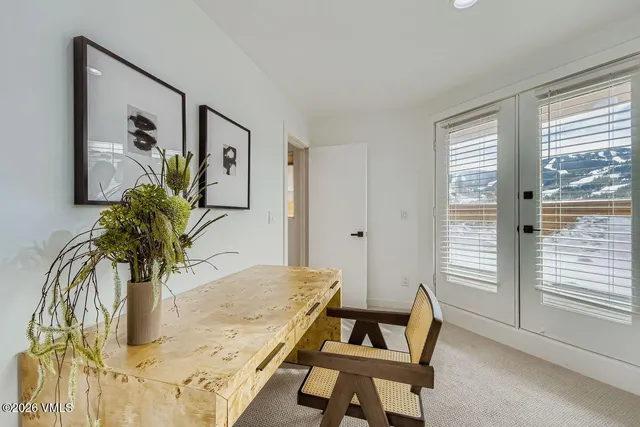 a view of a living room and dining room