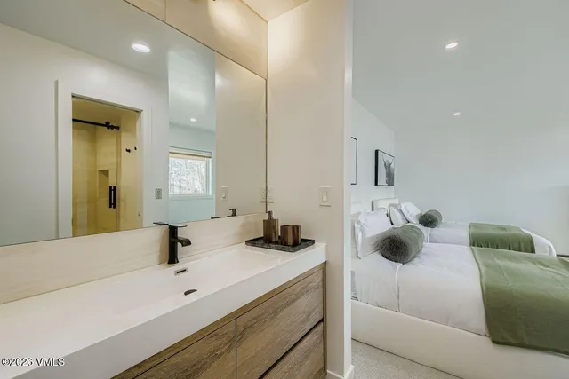 a bathroom with a sink and mirror