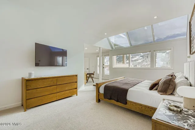 a bedroom with bed and window